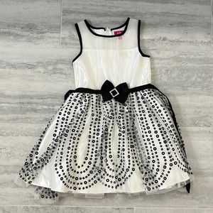 white and black polka dot formal child’s dress